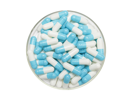 Blue cap and white core capsules