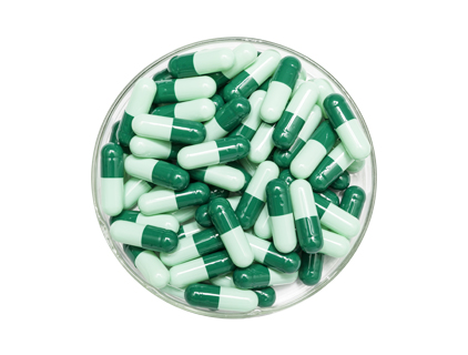 Dark green cap and light green core capsule