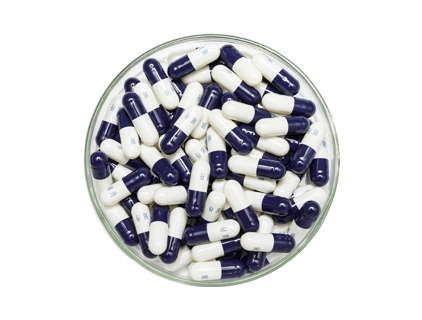 Teal cap and white core capsule